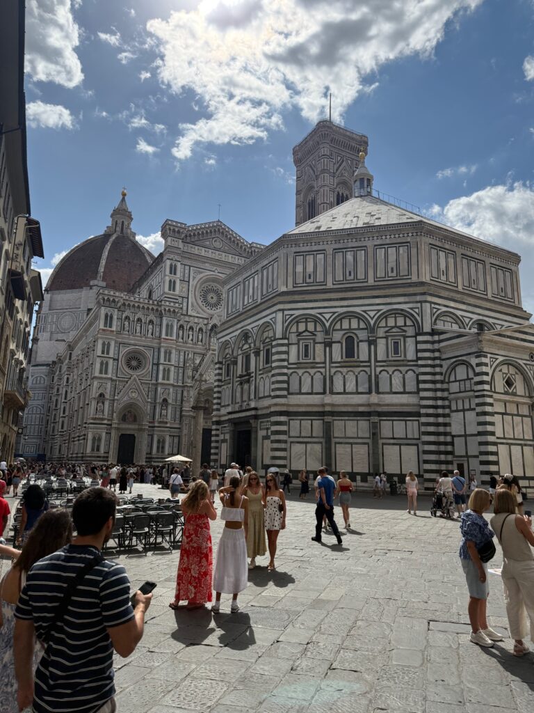 The Florence Duomo and Baptistery with visitors in the square