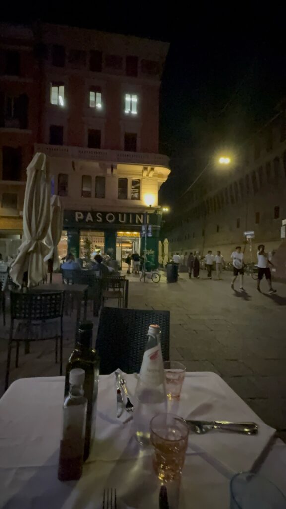 A street at night outside the Pasquini restaurant in Florence