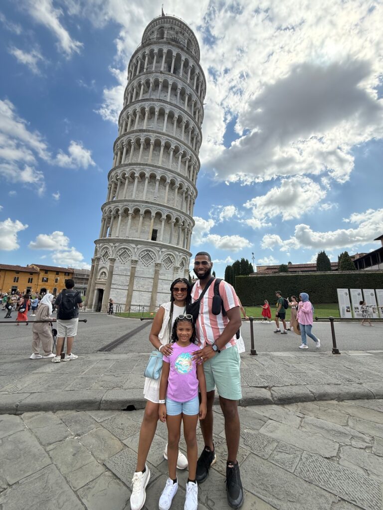 Dominique with his wife and daughter in front of the Leaning Tower of Pisa
