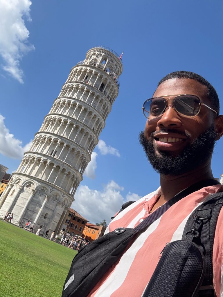 Dominique, founder of One Bored Traveler, in Pisa, Italy